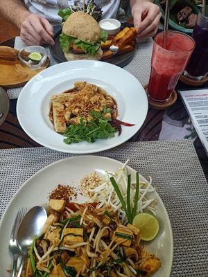 Pad Thai, tofu with tamarind sauce, mushroom burger with chips and salad at Reform Kafe in Chiang Mai