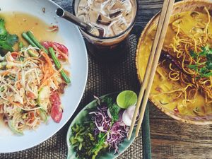 Som tam and Khao Soi soup at Reform Kafe in Chiang Mai