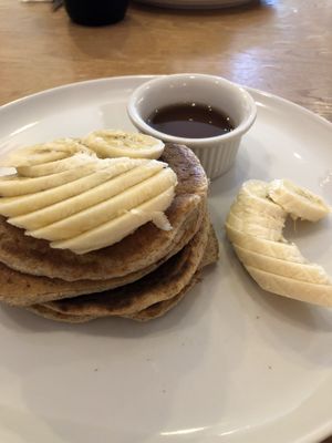 Banana pancakes with maple syrup at Nourish Cafe at Island Yoga in Palm Beach