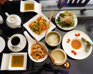 Chicken with pineapple and cashew nuts, rice, pumpkin cream soup, vegetables, spring rolls (with cheese), peppermint tea, black coffee. at May Quan Chay in Nha Trang
