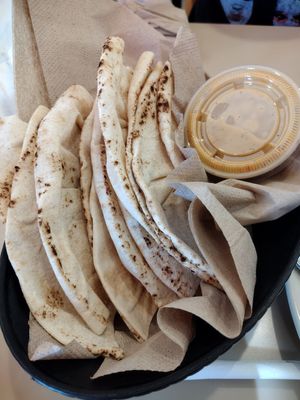 Fresh baked pita and hot sauce at Aladdin's Eatery in Mc Murray