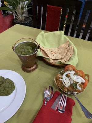 Saag aloo, roti and chana masala - the saag aloo and the bread were okay, but the chana masala was absolutely delicious! at Ganesh Indian Restaurant in Nha Trang