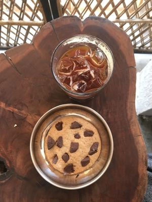 Homemade vegan choc chip cookie and iced americano! They also have soy/coconut milk options!  at Depth N Green in Mysore