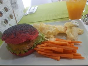 Quinoa and lentil burger with chips and carrot sticks at Vegana Burgers - Cais do Sodre in Lisbon