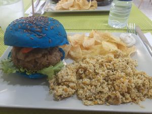 *special* smurf burger quinoa patty with pesto sides are chips and couscous (sweet potato & zucchini) at Vegana Burgers - Cais do Sodre in Lisbon