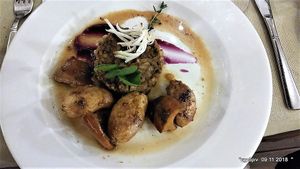 Lentils ''Moutzientra''
Rich ,flavourful, saucy lentils with copped vegetables on a
red cabbage pure, served with local forest mushrooms
stew and baby potatoes ''antinaxtes''. at O'Vrakas Taverna in Limassol