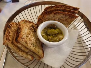 Complimentary bread basket with lemon dressed olives at O'Vrakas Taverna in Limassol
