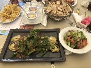 Pumpkin ravioli, pita and dips, salad and chips  at O'Vrakas Taverna in Limassol