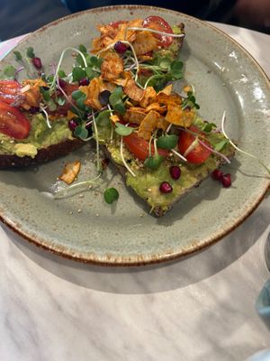 Beautiful avocado toast with pomegranate my favorite at O'YO - Brabantdam in Ghent