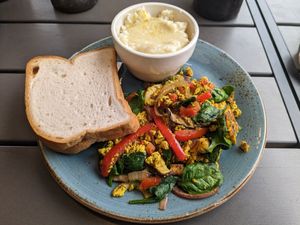 Tofu scramble with toast and grits (CAUTION: grits normally have cheese, order without if vegan) at Early Girl Eatery in Asheville