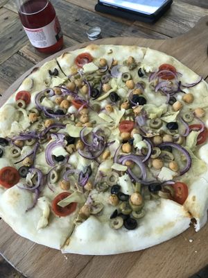 Hummus pizza 🍕  at Chutnej in Vinohrady
