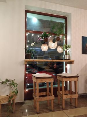 Lovely wooden furnishing and a lot of flowers at Chutnej in Vinohrady