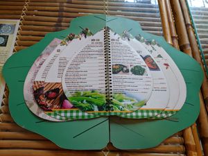 The menu, shaped like a lotus flower on a lily pad! at Yen Nha Hang Chay & Yoga in Nha Trang