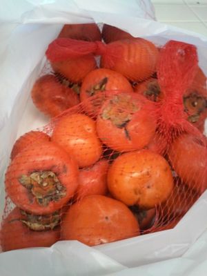 Tasty and ripe persimmons at Farmer's Market  in Moreno Valley