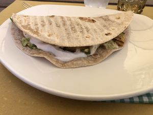 Kind of wrap with Avocado and zucchini. To less for a main dish  at Bottega Vegana in Modena