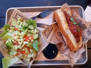 Vegan hot dog and salad at New York New York - BeerHaus in Las Vegas