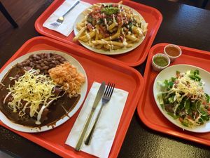 mole enchiladas, supreme fries, and a classic tostada (2017) at Pancho's Vegan Cantina in Las Vegas
