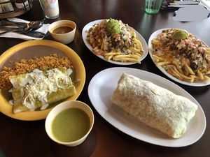 Verde Enchiladas, Two Supreme Fries (Small), and a Classic Burrito with Salsa Verde and Roja  at Pancho's Vegan Cantina in Las Vegas