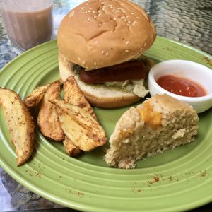 Burger with Sausage, Cheese, Pesto, Tomato & Avocado. Strawberry shake. at Natural Spice in Panama City