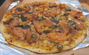 Pizza choose 4 ingredients: tomato, basil, red onions, vegan chorizo (extra) at Natural Spice in Panama City