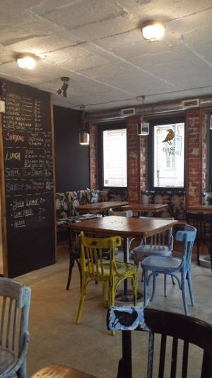 Cozy seats by the window faced on the Miodowa street.   at Brunet Kafe in Warsaw