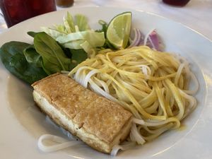 you mix it all together and pour curry sauce and vegan fish sauce over it  at Lila in Sarasota