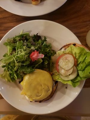 mushroom burger and side salad at Lila in Sarasota
