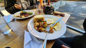 Foreground: vegetarian Rosemary bkfst, background: vegan Papas Loco at Orphan Breakfast House in Sacramento