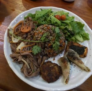 Fried brown rice, green salad, stir fried wheat noodles, veggie patty, springrolls and tofu!! at Thuc Duong Bao An - Bao An Macrobiotic in Da Nang