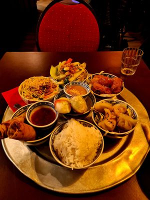 Spring Rolls, Papya Salad, Wok veggies, Ha Cao, summer rolls, marinated and fried seitan, bowl of rice at 1990 Vegan Living in Berlin