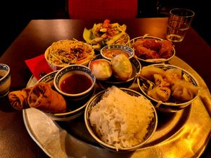 Spring Rolls, Papya Salad, Wok veggies, Ha Cao, summer rolls, marinated and fried seitan, bowl of rice at 1990 Vegan Living in Berlin