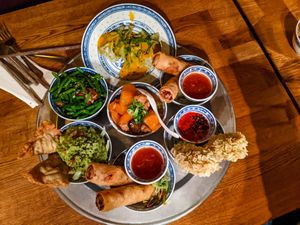 Delivery of first round of small dishes at 1990 Vegan Living at 1990 Vegan Living in Berlin