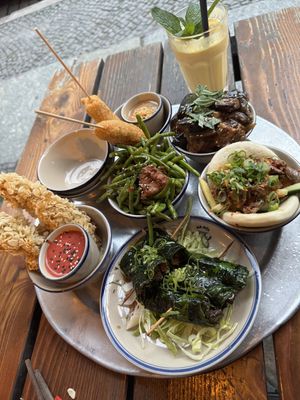 Various delicious small bowls and a mango/coconut drink  at 1990 Vegan Living in Berlin