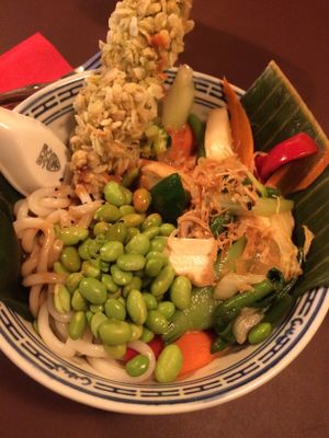 Udon noodles with tofu, seitan and veggies. Flavored with soy sauce and roasted sesame at 1990 Vegan Living in Berlin