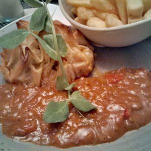 Vegetable filo parcel with curry sauce and chips at The Retreat Cafe and Tea Rooms in Grassington
