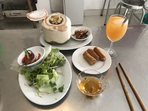 brown rice with coconut, spring roll and orange juice at Com Chay - Nguyen Du in Da Nang