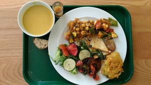 Onion and carrot soup. Some of the thinga in the plate: baked veggies, tofu with potato, chickpea caril, roasted eggplant, salad at DaTerra - Bom Sucesso Markt in Porto