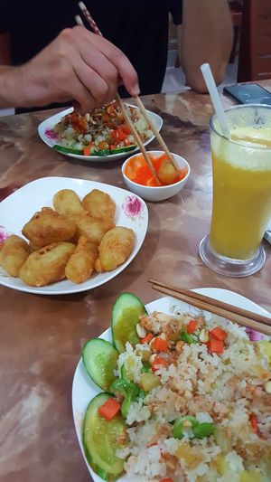 Fried rice, sweet potato cakes and passionfruit juice. at An Lac in Ninh Binh