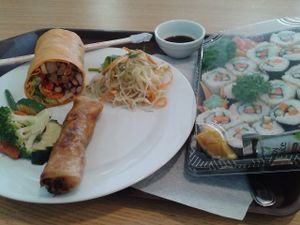A plate with buffet meals and sushi set at Veganland - Karlovo Namesti in Prague