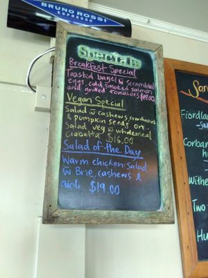 Vegan special: salad w/ cashews, cranberries & pumpkin seeds on salad veg w/ wholemeal ciabatta for $16 at Sandfly Cafe in Te Anau