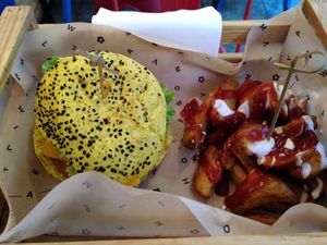 Yellow burger at Flower Burger in Turin
