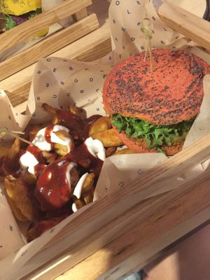 Mamma Mia burger and patatas bravas, drenched in sauce  at Flower Burger in Turin
