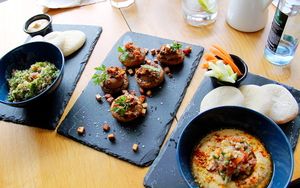 Three dishes: tabouleh, stuffed mushrooms and hummus.  at Organic Cafe in Fuengirola