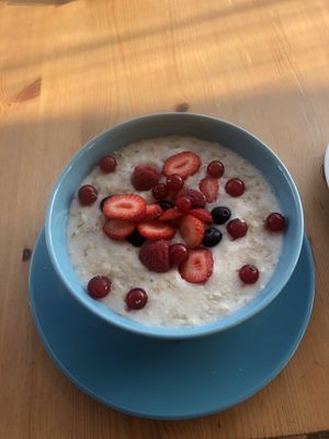 Almond milk porridge with mixed berries! Honestly amazing.  at Organic Cafe in Fuengirola
