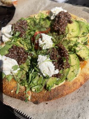 Avocado pizza with the almond cheese was exceptional.   at Urth Caffe in Laguna Beach