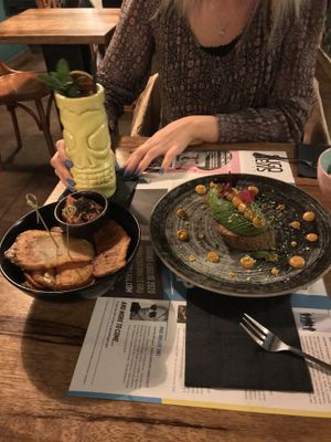 Open avocado and a sort of patatas bravas  at Gorilla in Turin