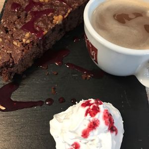 brownie and cappuccino  at Veggiezz - Alserbachstr in Vienna