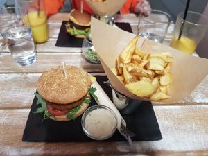 burger with home fries and herb dip at Veggiezz - Alserbachstr in Vienna