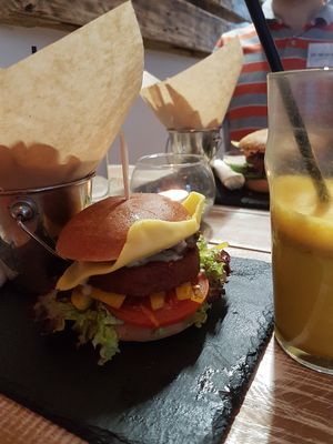 glutenfree burger with home fries and curcuma latte at Veggiezz - Alserbachstr in Vienna
