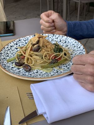 Spaghetti with cream of zucchini, black olives, tomatoes, local greens and bread crumbs   at Tipico in Ragusa
